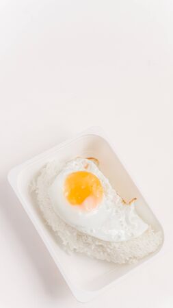 The inner box of rice is fried egg with white rice.の写真素材