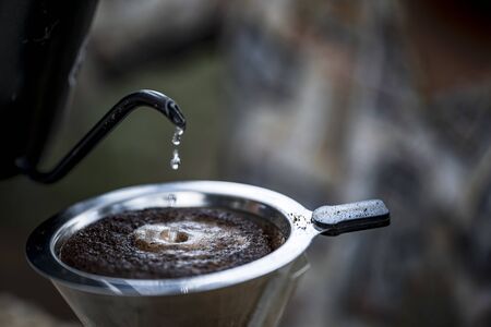 Coffee makers making coffee,drift,roasted coffee beans, hot drinkの写真素材