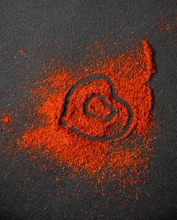 chili powder with the symbol of the heart. Food backgroundの写真素材