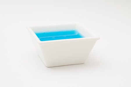 Sauce boat with blue waterの写真素材