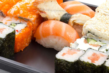 Set of sushi in black plastic boxの写真素材