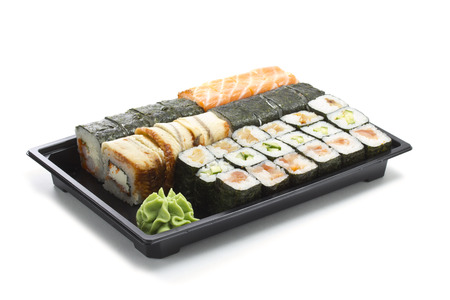 Set of sushi in black plastic boxの写真素材