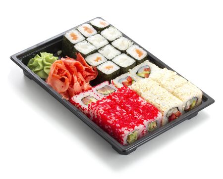 Set of sushi in black plastic boxの写真素材
