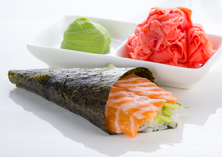Temaki with ginger and wasabi over white の写真素材