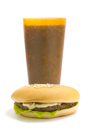 Cola and Big beautiful juicy burger with meat and vegetables. Isolated on white の写真素材
