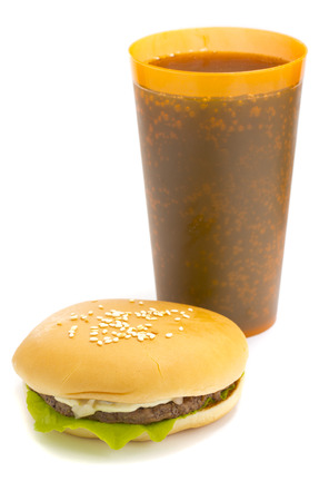 Cola and Big beautiful juicy burger with meat and vegetables. Isolated on white の写真素材