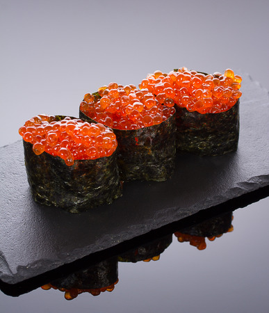 Sushi gunkan on a stone plateの写真素材