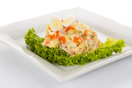 Russian traditional salad Olivier, isolated on whiteの写真素材
