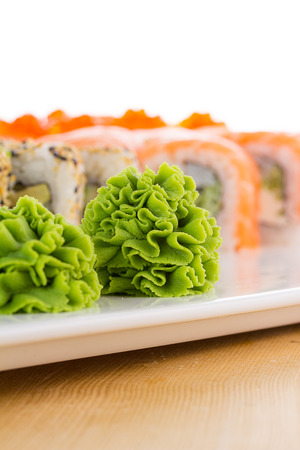 Sushi set on white plate over wooden backgroundの写真素材