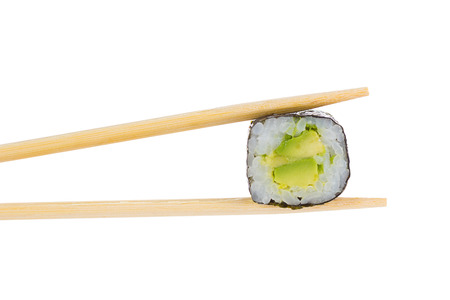 Sushi roll with chopsticks isolated on whiteの写真素材