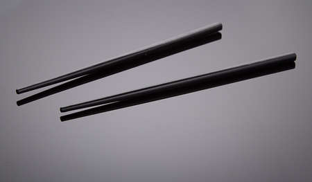 chopsticks over black backgroundの写真素材