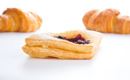 Delicious Cherry puff pastry with croissants isolated on whiteの写真素材