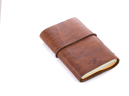 hand made leather notebook isolated on white backgroundの写真素材