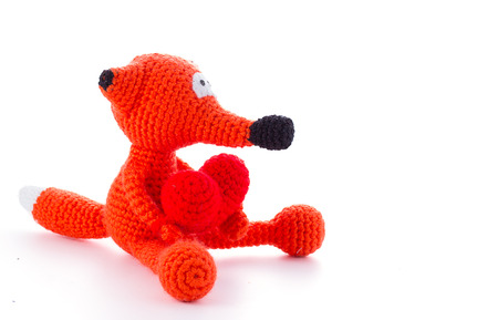 Knitted fox toy isolated on white backgroundの写真素材