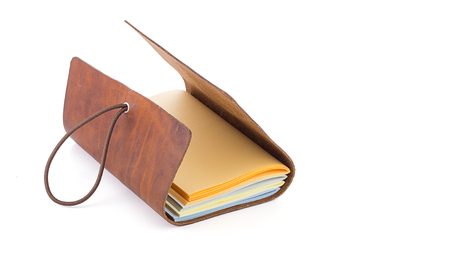hand made leather notebook isolated on white backgroundの写真素材