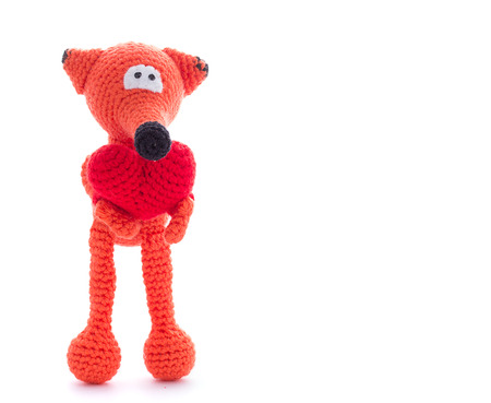 Knitted fox toy isolated on white backgroundの写真素材