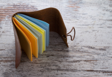 hand made leather notebook over wooden vintage background