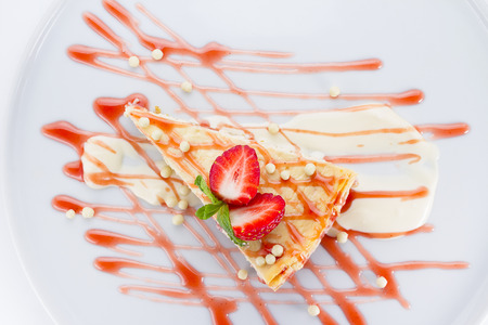 Strawberry cheesecake over white backgroundの写真素材
