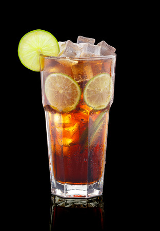 Cuba libre cocktail over black backgroundの写真素材