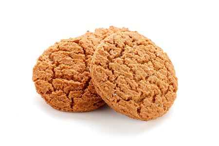 Sweet oatmeal cookies isolated on white backgroundの写真素材