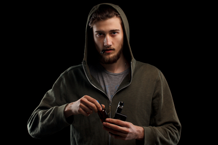 vaping man holding a mod.の写真素材