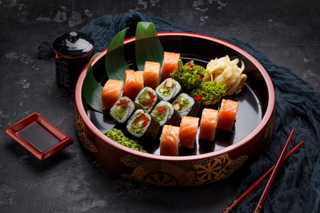 Japanese cuisine. Sushi set over dark background.の写真素材
