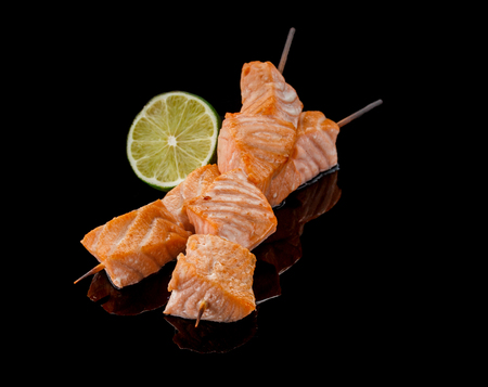 Japanese cuisine. Salmon shashlik on a black table.の写真素材