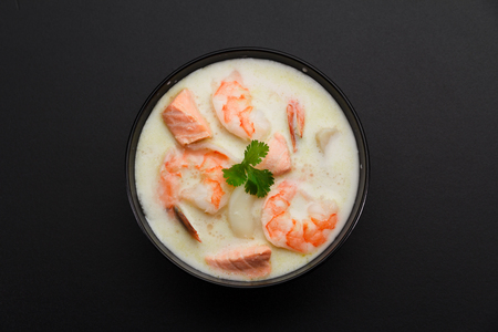 Tom kha soup with seafoods over dark background.の写真素材