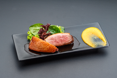 Duck meat over dark background.の写真素材
