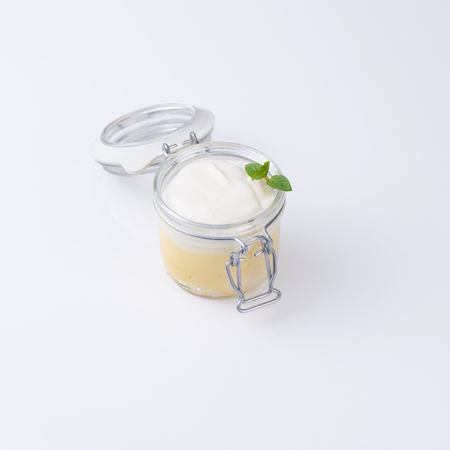Sweet dessert in a special bottle isolated on white background.の写真素材
