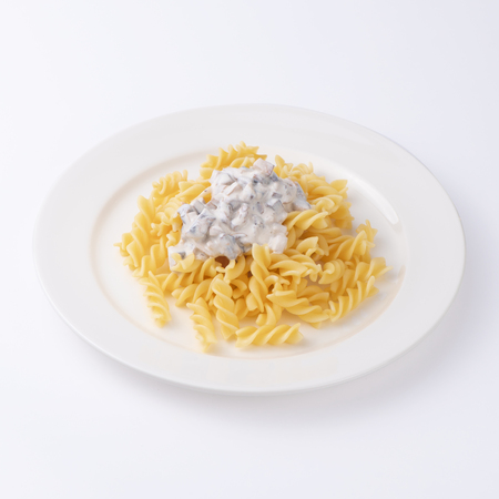 Pasta with bechamel sauce isolated on white.の写真素材
