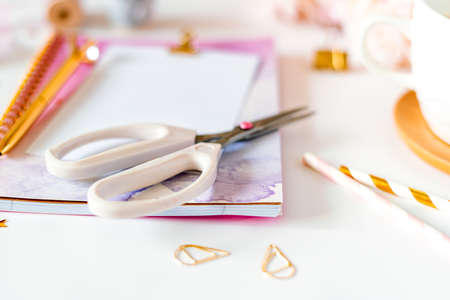 Desktop handmade DIY tools. Top view of white working table background with cup of coffee. Flat lay...