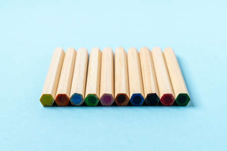 Close up Wooden Color pencils on blue background close up.Beautiful color pencils.Color pencils for...