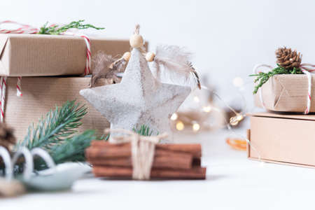 Merry Christmas and Happy New Year on white background. Holidays greeting card. Christmas lights and decoration with wrapping gifts. Selective focusの写真素材