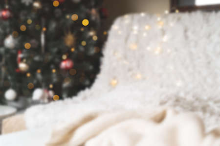 Christmas background or greeting card with space for text. Glowing snow bokeh. Winter holidays on white background.の写真素材