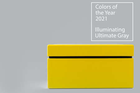 Yellow box on trendy gray background with copy space. Illuminating Yellow and Ultimate Gray, new...