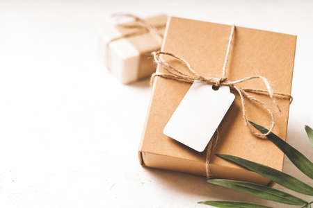 Craft eco Gift or present box with bow and on white background. Copy space for text and design. Soap, zero waste, plastic free, eco friendly concept.の写真素材