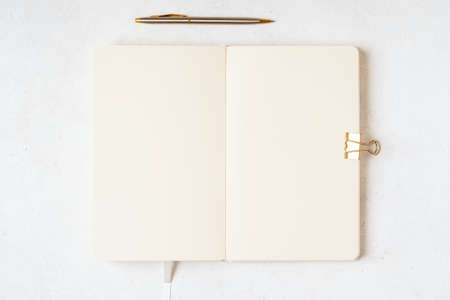 Top view blank paper Notebook, and pen. Desktop mock up, Flat lay of white working table background...