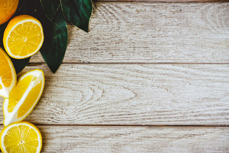 Fresh sliced lemon on wooden natural background with space for text. Healthy food concept.の写真素材