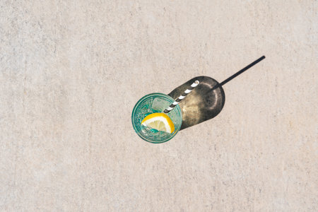 Closeup shot of tropical sparkling mint lemonade cocktail. Blank copy space picture of summer alcohol free drink dropping a shadow on marble floor. Hello summer holiday vacationの写真素材