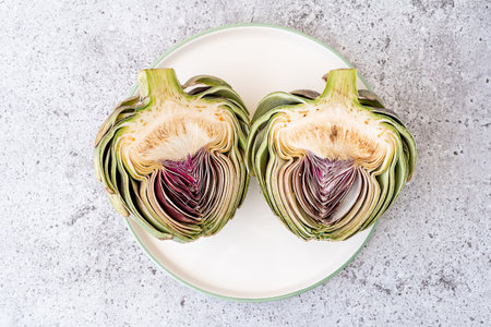 Top view Sliced artichoke on plate on table. Healthy food vegetablesの写真素材