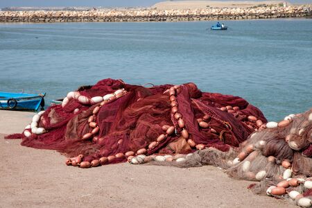 fishing nets on the shoreの写真素材