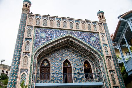 house with mosaic exterior wall decoration