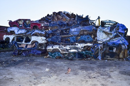 The recycling of scrap metal, stacked rows presovanny machines.の写真素材