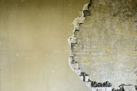Partially destroyed wall inside an industrial building under demolition.の写真素材