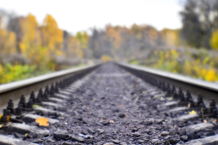 Soft blur photos taken on the soft lens. Railroad in autumn stretches into the distanceの写真素材