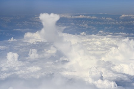 The top view on clouds from an airplane window.