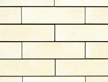 Natural texture of large light yellow bricks. Background