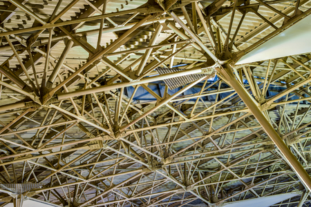 View inside a large building on a solid ceiling construction.
