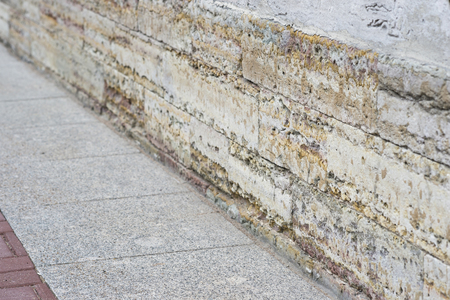 A fragment of the Foundation of an old building with a number of modern paving slabs. Background.の写真素材